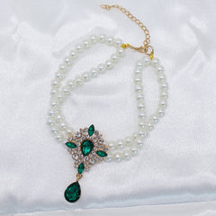 Elegant Pearl Crystal Collar – Double-layer pearl collar with green teardrop crystal pendant, white satin