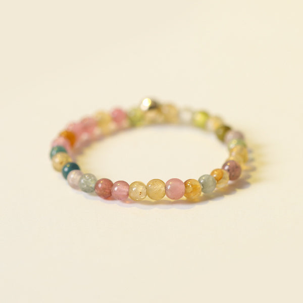 2mm Citrine Ring – Multicolor gemstone tiny beads with gold spacer on warm cream background, boho stack ring
