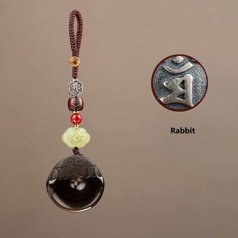 Pixiu Keychain – Rabbit zodiac silver glyph detail on ice obsidian disc with cord