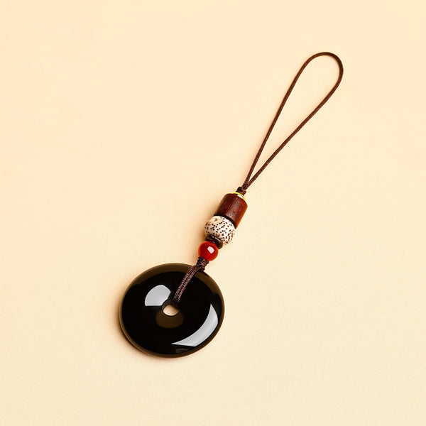 Jade Keychain Pendant – Black jade donut with slim cord and star moon bodhi beads on beige, minimalist keychain