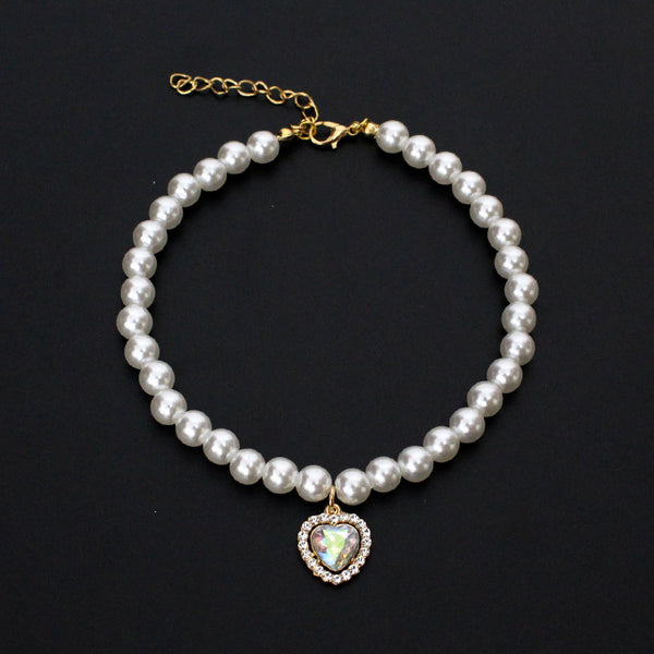 Crystal Heart Pet Necklace – Pearl collar with iridescent heart crystal pendant surrounded by rhinestones