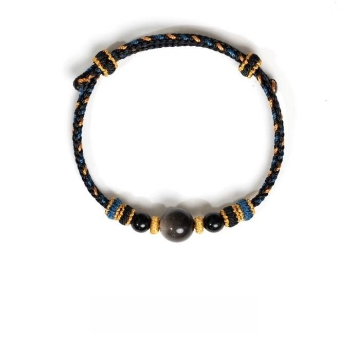 Dunhuang Agate Bracelet – black cord bracelet with dark obsidian center bead and small black beads with gold spacers, protection accessory