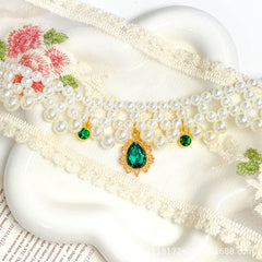 Luxury Pearl Pet Necklace - Pink crystal teardrop pendant with white pearls on white background, luxury pet collar