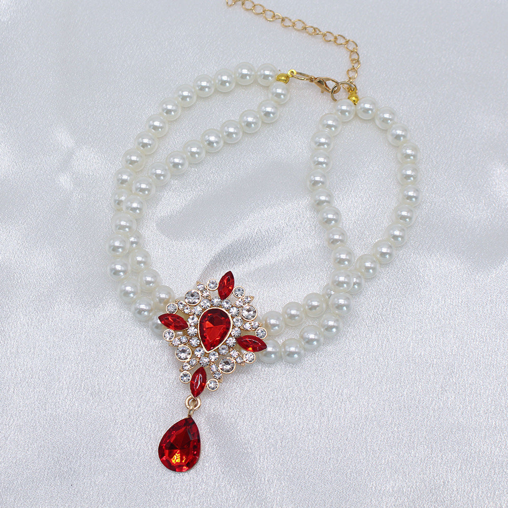 Elegant Pearl Crystal Collar – Double-layer pearl collar with red teardrop crystal surrounded by rhinestones