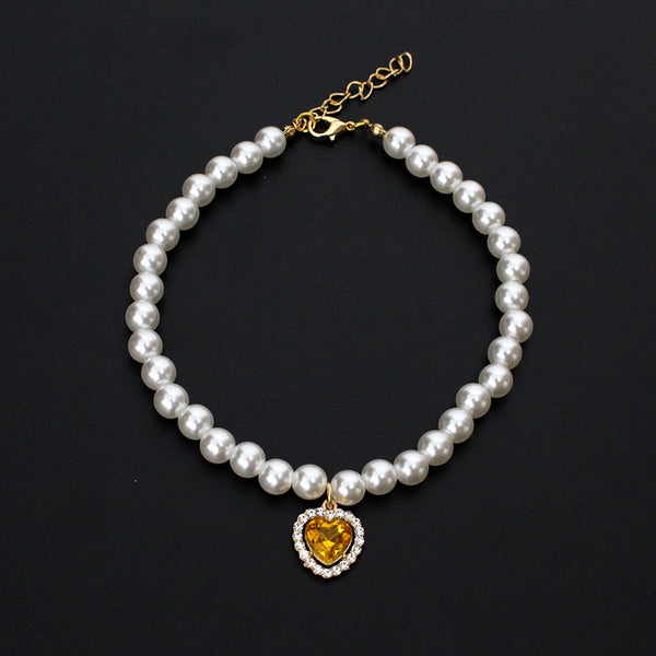 Crystal Heart Pet Necklace – Pearl collar with yellow heart crystal pendant and rhinestone border, gold clasp