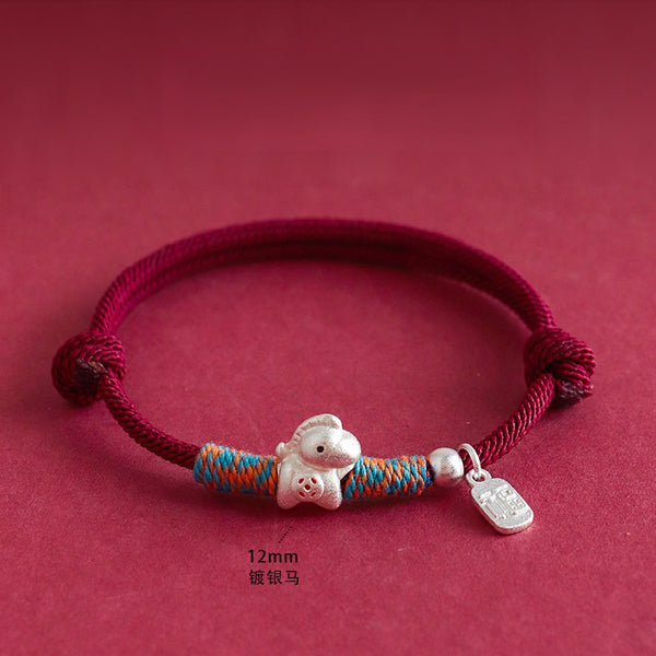 Year of the Horse Bracelet – Red cord silver horse charm with blue-orange wraps on red, feng shui
