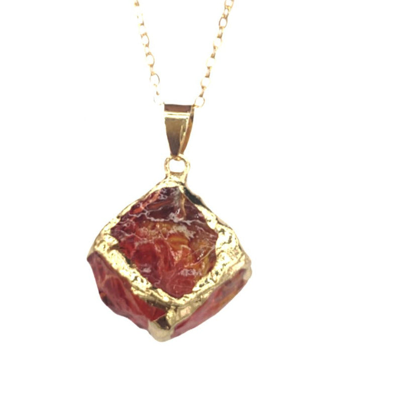 Gemstone Chip Pendant – Red garnet raw crystal cube in gold frame pendant on chain, white background