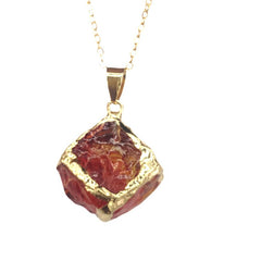 Gemstone Chip Pendant – Red garnet raw crystal cube in gold frame pendant on chain, white background