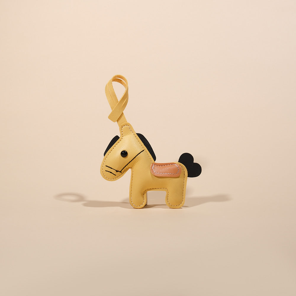 Feng Shui Leather Horse Keychain – Yellow PU leather horse with black mane and tan saddle, cute keychain