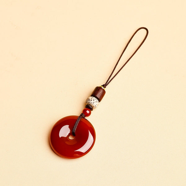 Jade Keychain Pendant – Red-brown jade donut with thin rope and wood beads on beige, car key accessory gift