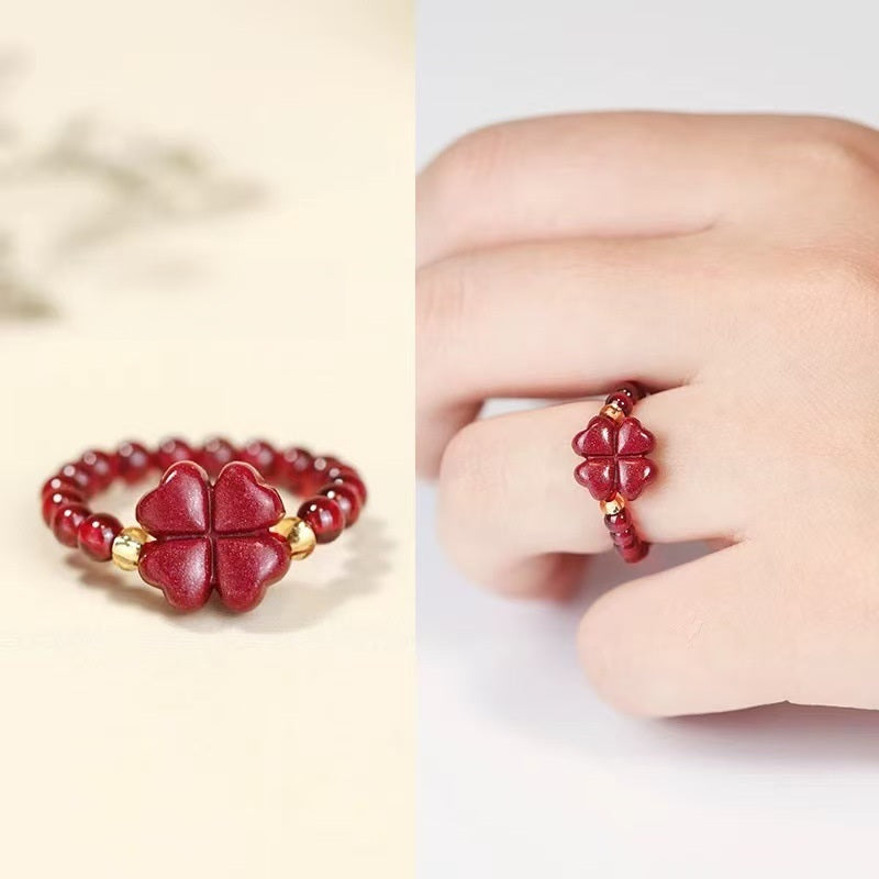 Cinnabar Clover Ring – Red cinnabar four-leaf clover bead ring with gold accents, product and worn split view