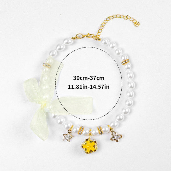 Luxury Crystal Pet Necklace – pearl strand with yellow gemstone pendant, star charms, ivory organza bow, 30-37cm
