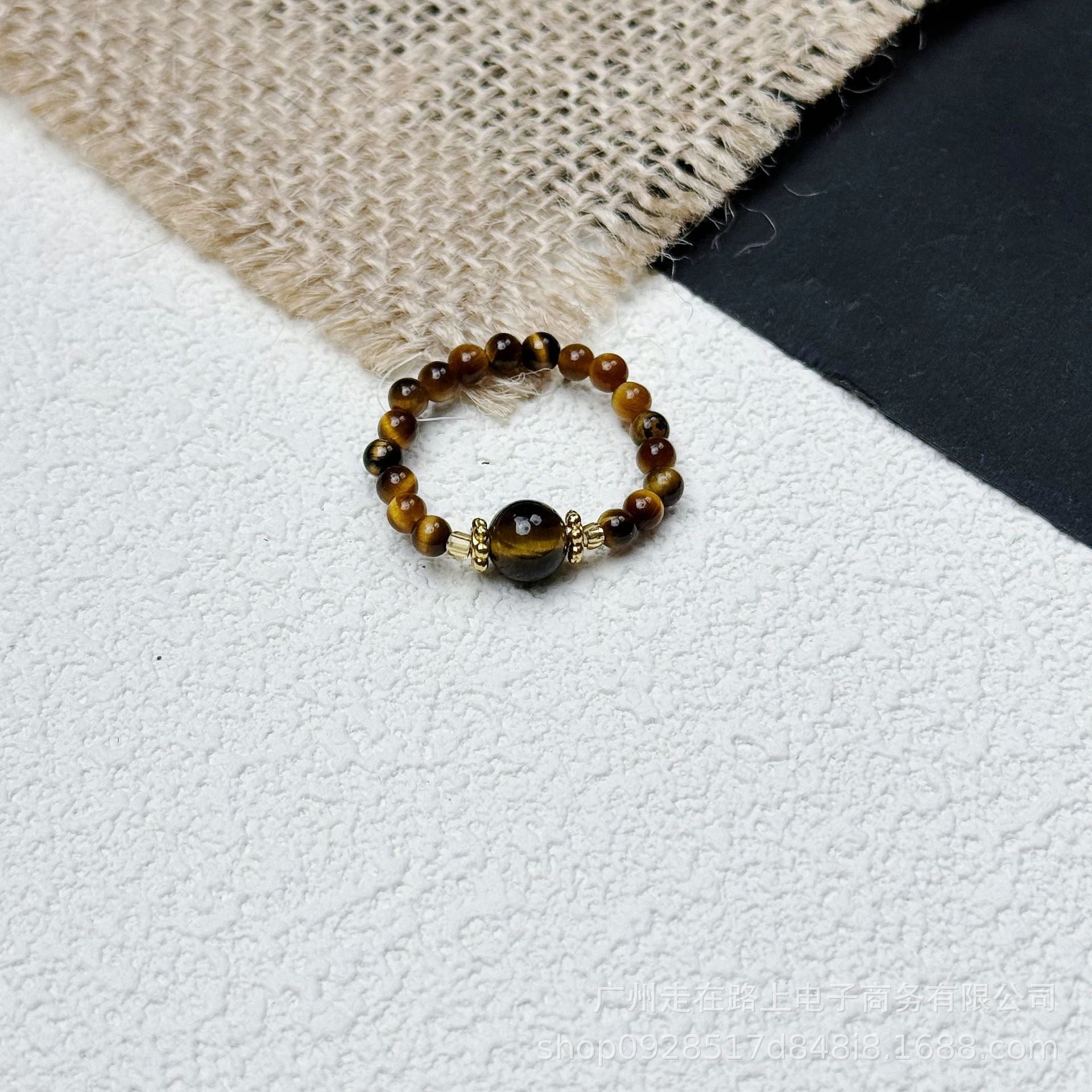 Tiger Eye Beaded Ring – Tiger eye beads with black tiger eye center on white burlap, strength jewelry