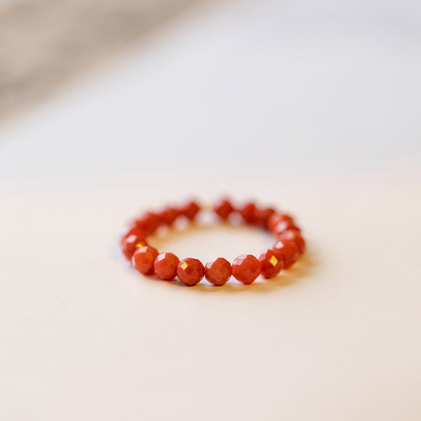 2mm Citrine Ring – Tiny red faceted bead ring on white surface, bold stacking crystal jewelry