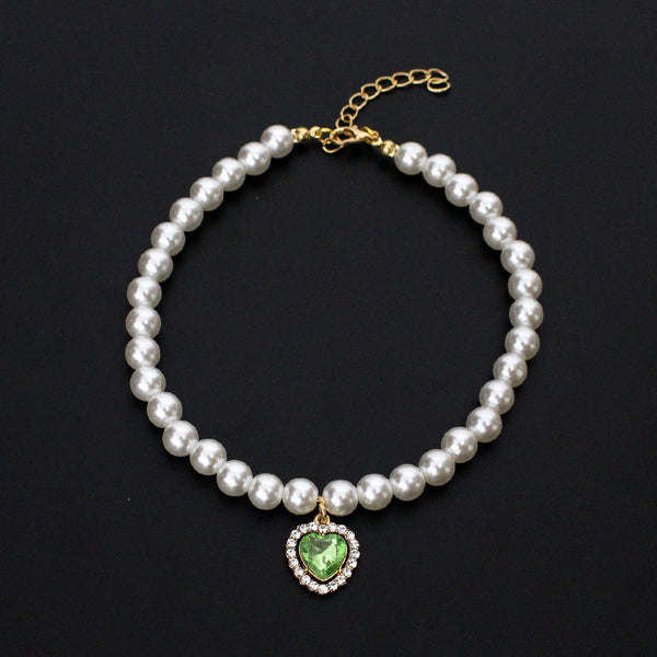 Crystal Heart Pet Necklace – Pearl collar with green heart crystal pendant surrounded by rhinestones, black