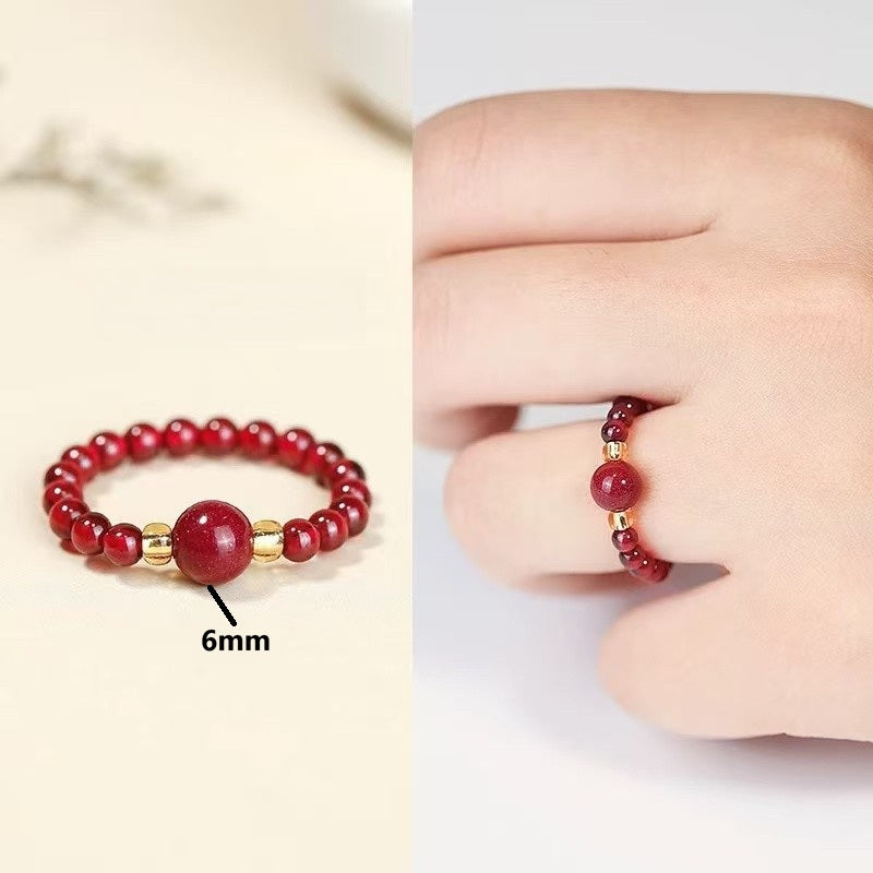 Cinnabar Bead Ring – 6mm red cinnabar bead ring with gold spacers, split product and hand-worn view