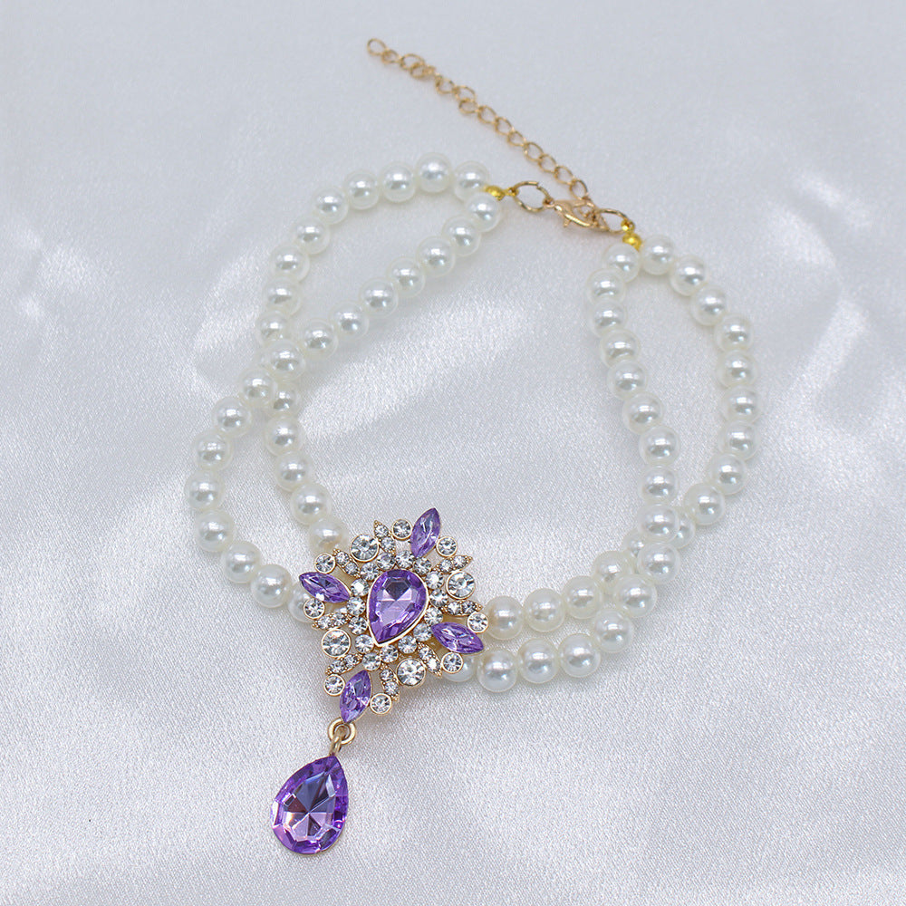 Elegant Pearl Crystal Collar – Double-layer pearl collar with purple teardrop crystal pendant, white satin