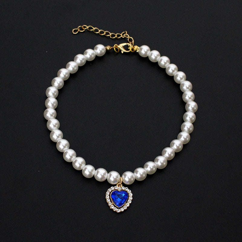 Crystal Heart Pet Necklace – Pearl collar with dark blue heart crystal pendant and rhinestone halo, black