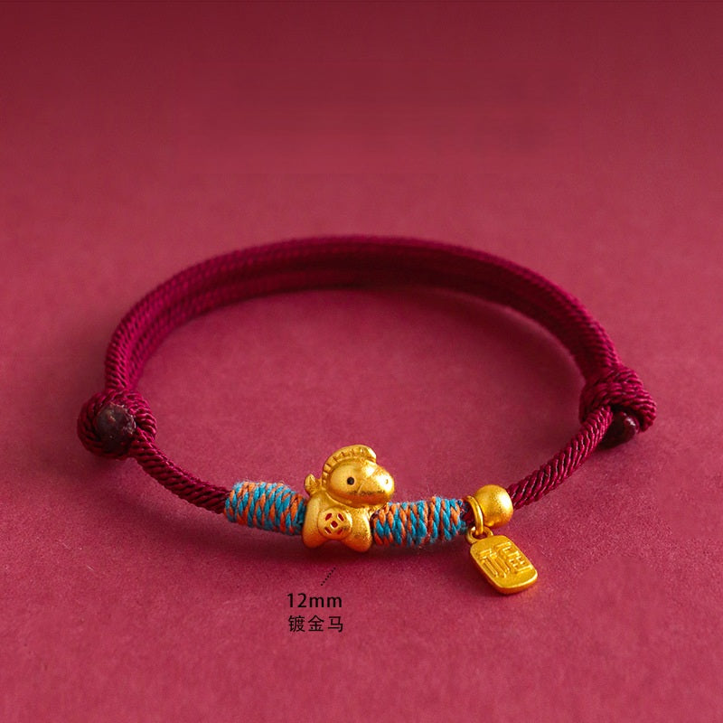 Year of the Horse Bracelet – Red cord gold horse charm with blue-orange wraps on red, prosperity
