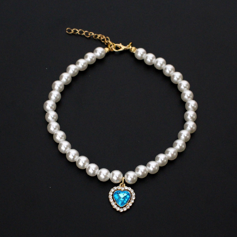 Crystal Heart Pet Necklace – Pearl collar with light blue heart crystal pendant and rhinestone border