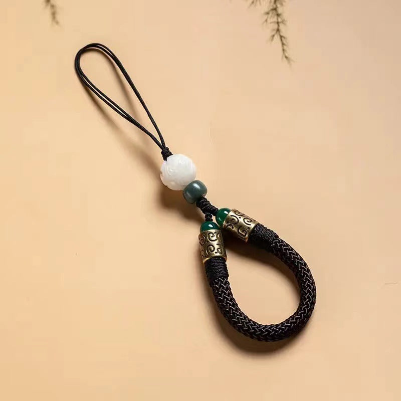 Lotus Bodhi Lanyard – Black braided cord lanyard with carved white lotus bead and antique brass accents, enlightenment charm