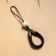 Lotus Bodhi Lanyard – Black braided cord lanyard with carved white lotus bead and antique brass accents, enlightenment charm