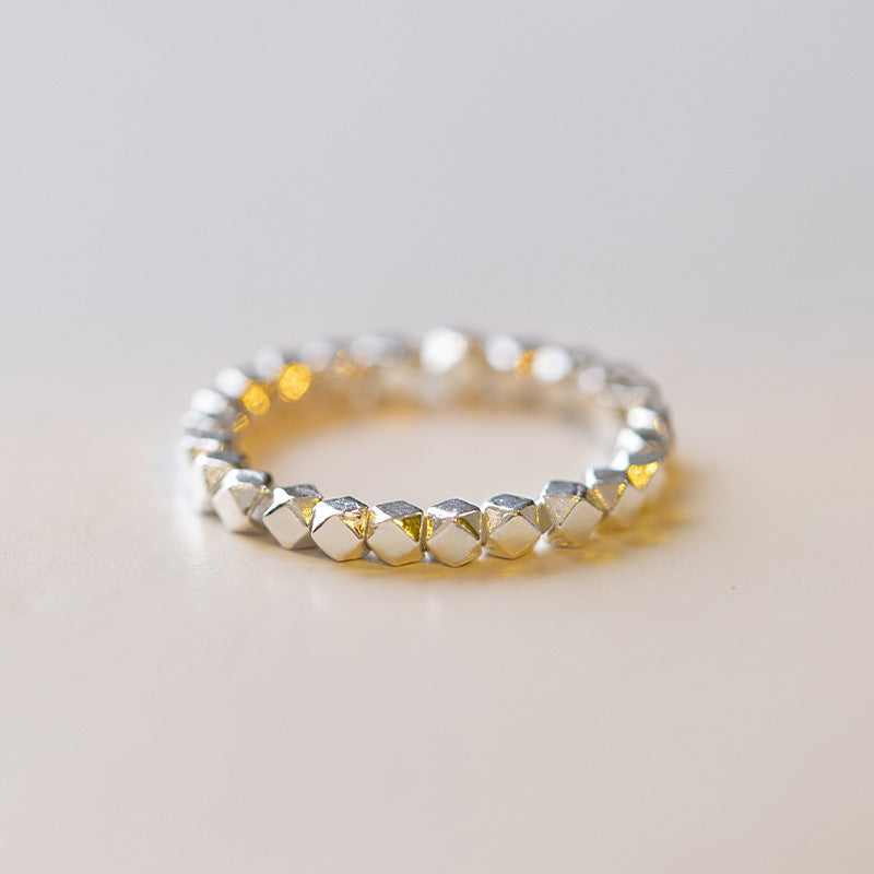 2mm Citrine Ring – Tiny silver faceted bead ring with geometric cut on white, modern minimalist band