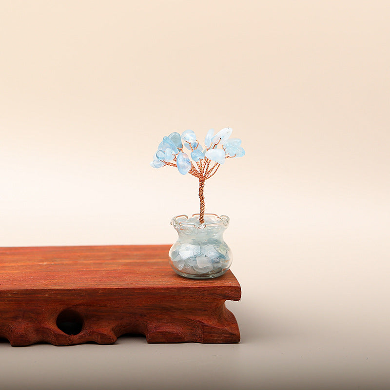 Mini Wealth Tree – aquamarine blue crystal tree on wood stand, glass geode pot, beige background, calm energy decor