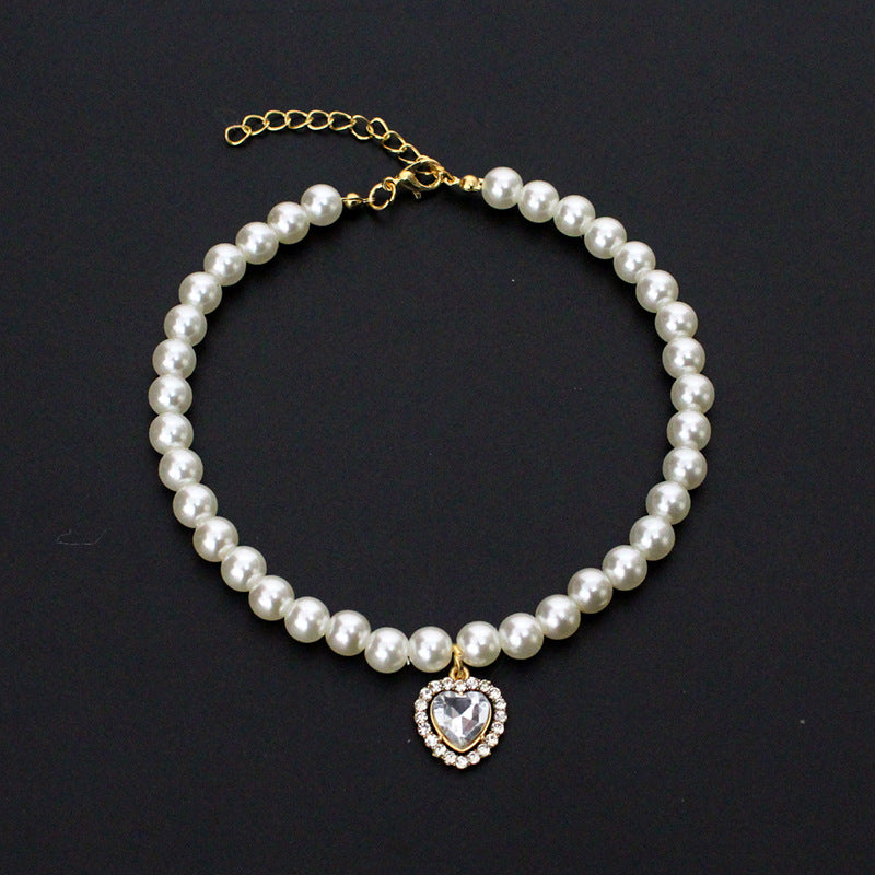 Crystal Heart Pet Necklace – Pearl collar with clear heart crystal pendant surrounded by rhinestones, black