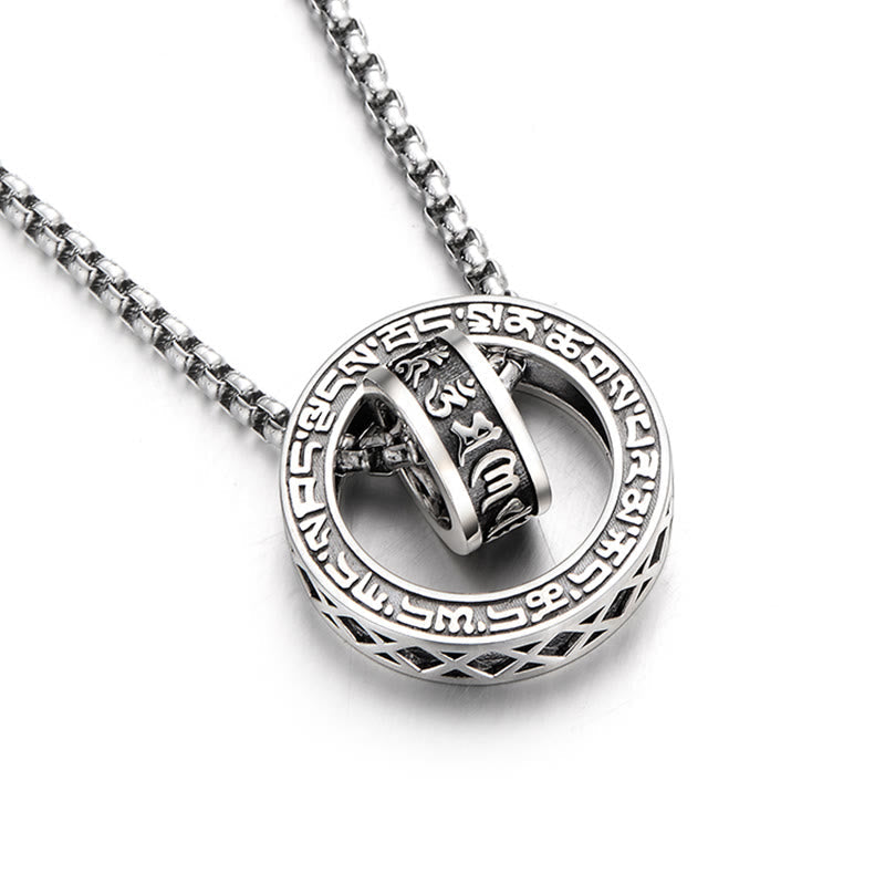 Om Mani Padme Hum Silver Pendant Necklace – Silver box chain with circular pendant and engraved cylinder, diagonal overhead view on white