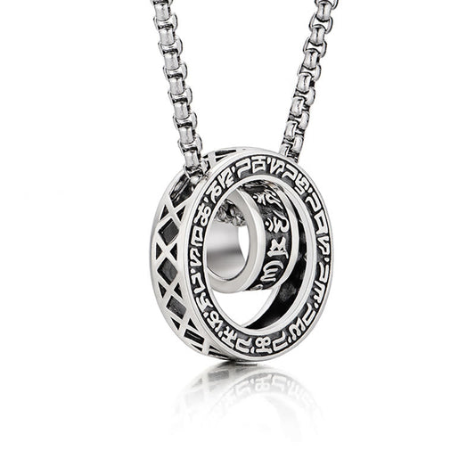 Om Mani Padme Hum Silver Pendant Necklace – Silver circular pendant with Tibetan script outer ring and inner engraved bead, angled side view on white