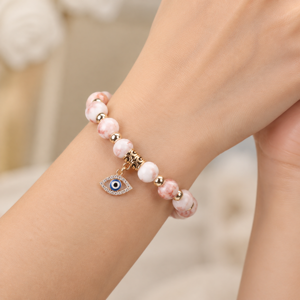 Pink Zebra Stone Evil Eye Bracelet - wear closeup