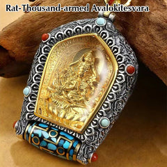 Tibetan Zodiac Buddha Dzi Bead Necklace – Gold Samantabhadra Bodhisattva figure in silver scrollwork frame with turquoise coral and decorated prayer wheel on wood branch close-up