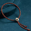 Multicolor braided cord bracelet with engraved bead