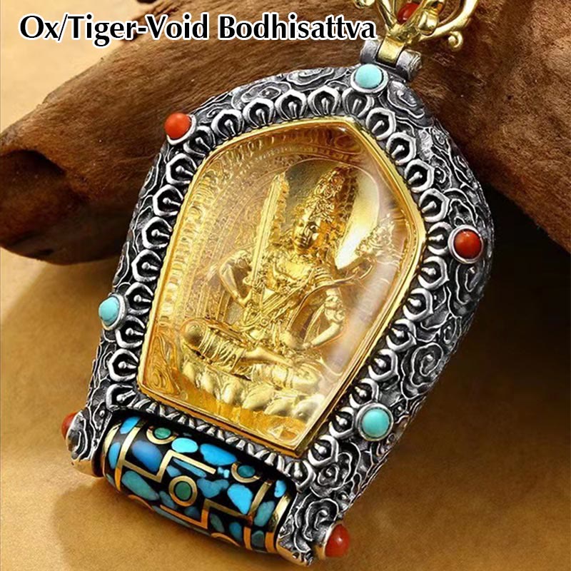 Tibetan Zodiac Buddha Dzi Bead Necklace – Gold seated Buddha in silver filigree frame with turquoise coral gemstones and prayer wheel element, brown wood branch background