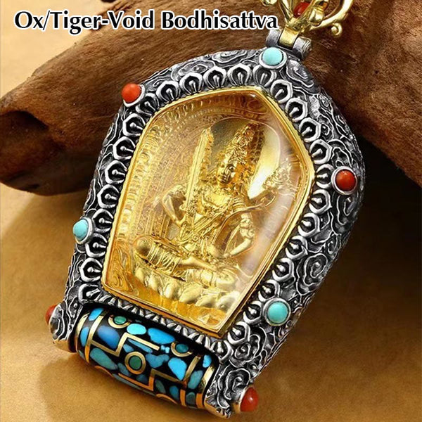 Tibetan Zodiac Buddha Dzi Bead Necklace – Gold seated Buddha in silver filigree frame with turquoise coral gemstones and prayer wheel element, brown wood branch background