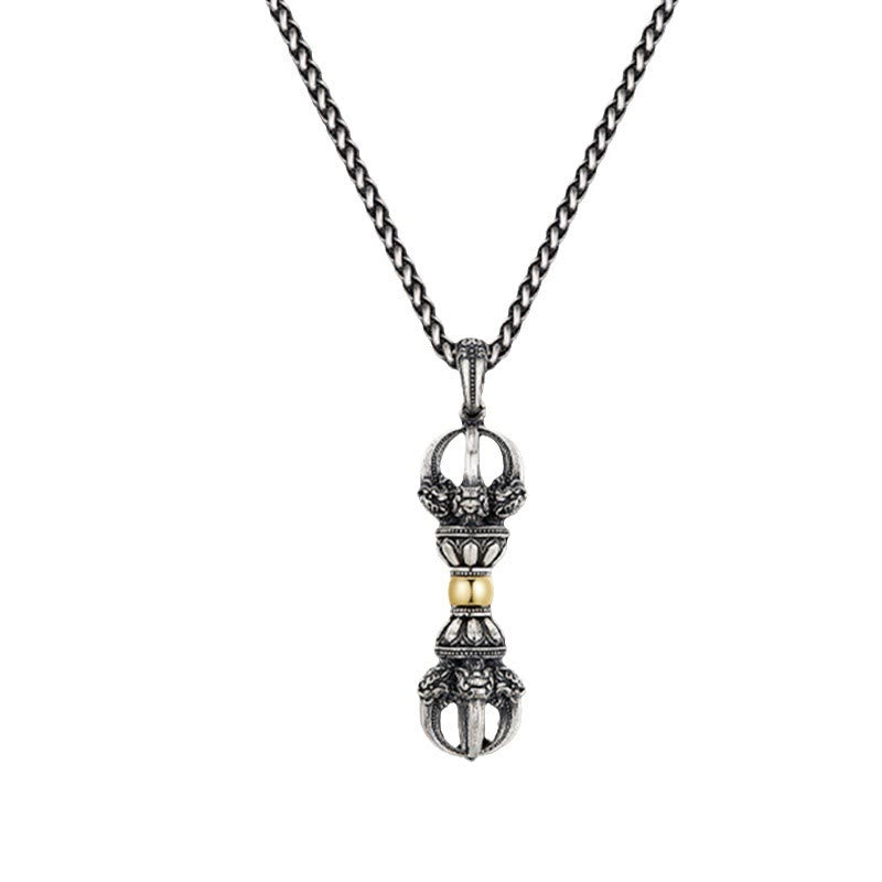 Tibetan Vajra Dorje Pendant Necklace – Frontal view showing symmetrical prongs and beast face motifs, black dramatic background